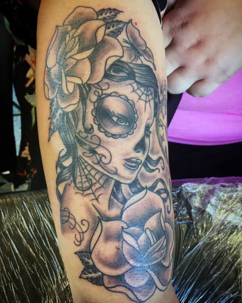 Female character face with floral design tattoo. John at Rogsy Tattoo Studio.