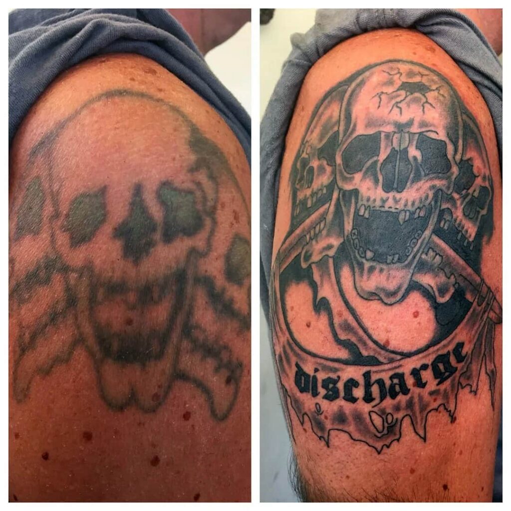 Tattoo touch up. Skulls with discharge logo text. John at Rogsy Tattoo Studio.
