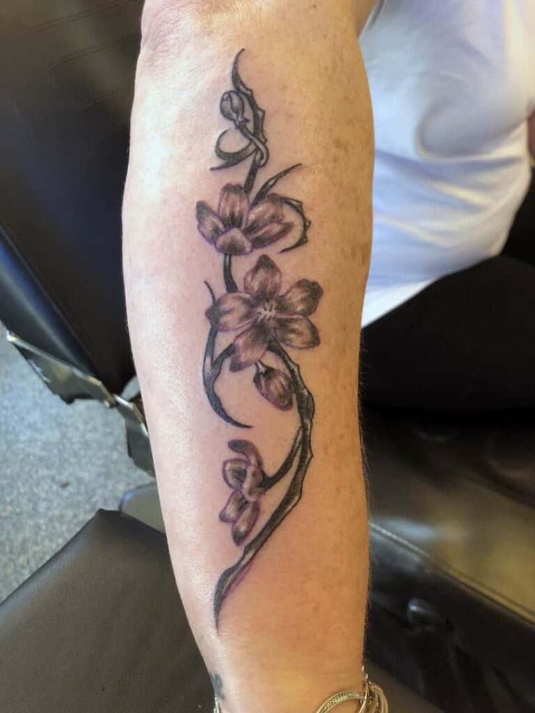 Flower design tattoo. lower arm. John at Rogsy Tattoo Studio.