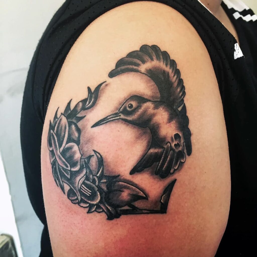 Hummingbird with flowers tattoo. Top of arm. John at Rogsy Tattoo Studio.